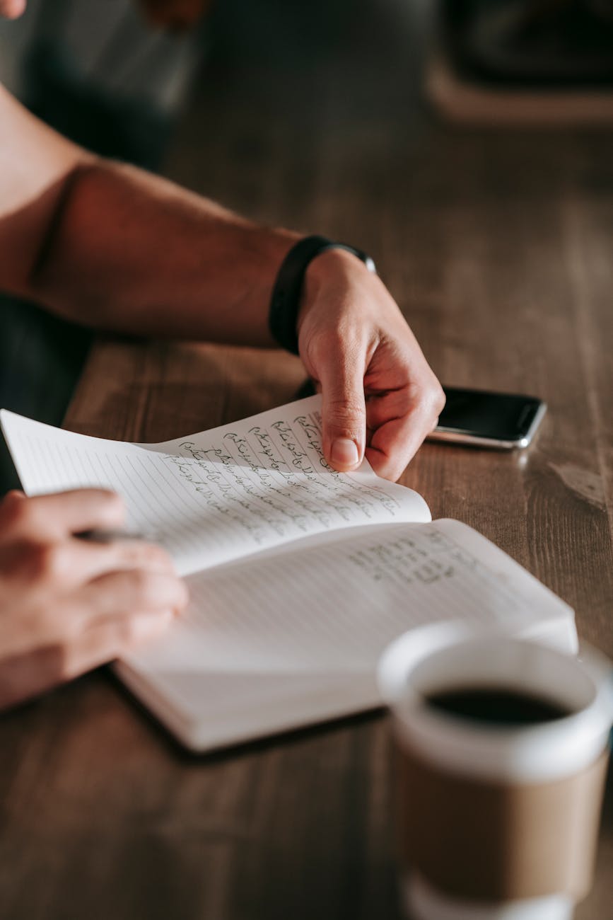  A notebook with handwritten gratitude entries, illustrating the practice of gratitude journaling.